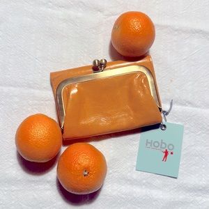 Vintage Robin Hobo wallet in rare tangerine color. Never used, mint condition.